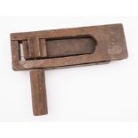 A WWII era wooden clacker. Having a wooden handle and steel back plate, 31cm long.