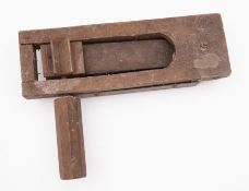 A WWII era wooden clacker. Having a wooden handle and steel back plate, 31cm long.