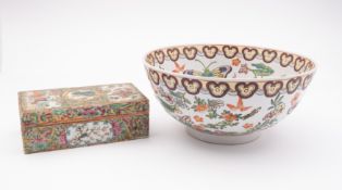 A Canton porcelain rectangular box and cover profusely decorated in the typical palette, 18cm long,