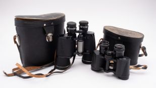 A pair of Prinz 10x30 binoculars in case and a pair of Russian 8x30 binoculars in case ( 2)