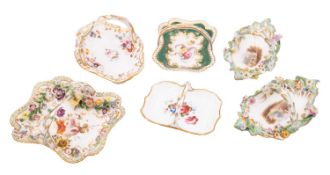 A group of six small English porcelain baskets, circa 1830-40 including a pair,