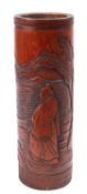 A large Chinese bamboo brushpot carved with a dignitary in a lake landscape with plantain leaves