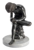 An Italian patinated bronze model of the Spinario,