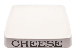 G. Rushbrooke [Smithfield] Ltd. a pottery grocer's cheese stand of dished square form,