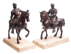 A pair of substantial Italian patinated bronze equestrian groups,