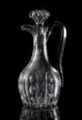 A large 19th century cut and engraved glass claret jug and stopper;