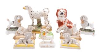 Ten pottery and porcelain dog groups,