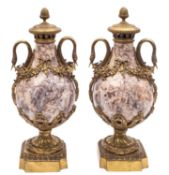 A pair of Continental mottled mauve and white marble and gilt metal mounted side urns,