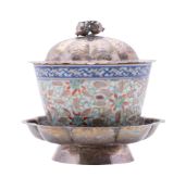 A Chinese silver-mounted porcelain 'rice grain' cup, late Qing dynasty with engraved silver stand,