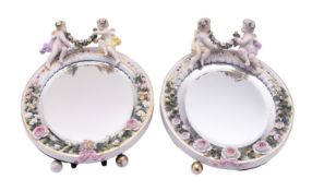 A pair of Plaue porcelain easel mirrors each of oval flower