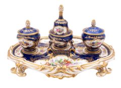 A 19th century English porcelain desk stand of oval rococo form in the Sevres manner,