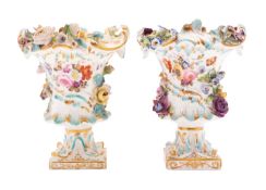 A pair of Coalport flower-encrusted urn vases, circa 1820-30 each with acanthus moulding,