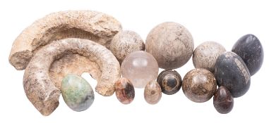 A collection of eleven polished stone spheres and eggs; including examples in Purbeck,