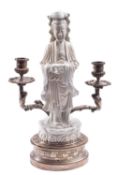 A Chinese Blanc de Chine figure of Guanyin mounted on a two-light silvered metal candelabra base