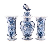 A garniture of three Dutch Delft vases In de Klauw [The Claw] comprising a baluster jar and cover
