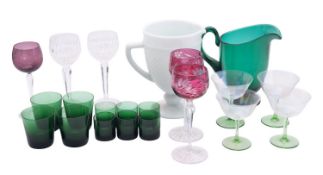 A mixed group of primarily coloured glass comprising a green glass pedestal jug