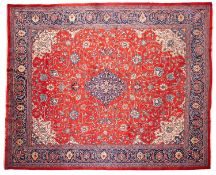A Sarouk Mahal carpet, the madder field with a central indigo lozenge pole medallion,