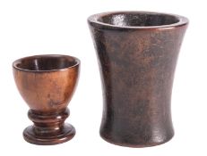A turned treen pedestal salt, 19th century; with knopped and waisted stem to a circular base,