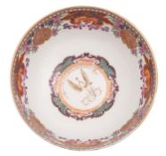 An English armorial porcelain punch bowl,