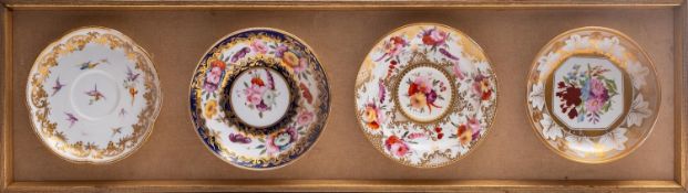 A set of four 19th century Continental porcelain shield-shaped wall plaques,