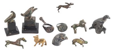 A GROUP OF THREE ROMANO-BRITISH ENAMELLED BRONZE FIBULAE AND FOUR BRONZE ANIMALS,