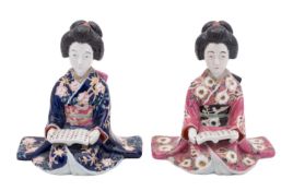 A pair of Japanese Kutani porcelain figures of seated bijin,