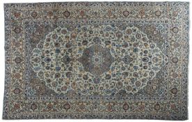 A Kashan carpet, the pastel blue cartouche field with a central cartouche pole medallion,
