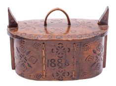 A Scandinavian treen trinket or food box, dated 1886; of oval section; the cover with arch handle,