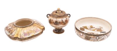 Three pieces of Satsuma earthenware comprising a small pedestal jar and pierced cover decorated