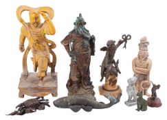 A mixed group of Chinese, Japanese, Central American and other figures in metal, wood and stone,