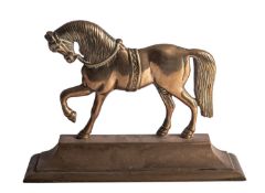A Victorian brass door porter cast as a horse,