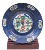 A Chinese famille verte and powder-blue ground charger, Kangxi from The Japanese Palace,