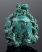 A Chinese turquoise snuff bottle and stopper carved with a standing figure,