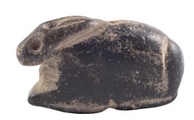 A MESOPOTAMIAN BLACK STONE HARE AMULET CIRCA 3RD MILLENNIUM B.C. drilled for suspension, 3.8cm.
