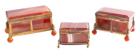 Three striated agate and gilt metal mounted trinket boxes,