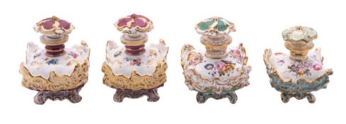 A pair of Coalport magenta and pale yellow-ground scent bottles and stoppers and two similar