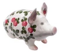 A large Plictha pottery pig, painted by Joseph Nekola with flowering clover,