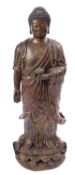 A Tibetan patinated metal figure of Buddha and a Thai bronzed metal figure of a Guardian lion,