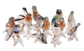 Twelve Karl Ens bird figures including a Jay, two Kingfishers, Crested Tit, Chaffinch,