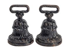 A pair of early Victorian painted cast iron door porters,