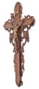 A metal mounted and carved oak crucifix and Corpus Christi,