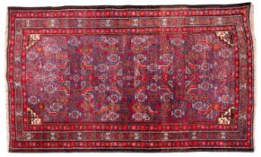 A Turkoman rug, the lilac field with all over geometric designs, enclosed by a triple border,