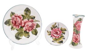 Three pieces of Wemyss pottery each decorated with pink cabbage roses comprising a plate painted by