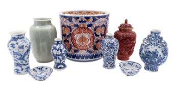 A mixed group of Oriental porcelain including a celadon glazed jar with incised decoration,