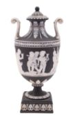 A Wedgwood black jasper ware pedestal vase and cover,