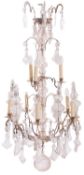 A silvered metal and glass ten branch chandelier, in Louis XV taste,