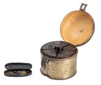 A cylindrical metal travelling spicebox,