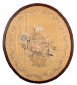 A Victorian silkwork embroidery depicting a basket of flowers,