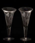 Pair of large ale glasses the trumpet shaped bowls engraved with hops and barley on a straight stem