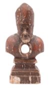 A Continental carved and painted wood reliquary modelled as the bust of a saint-bishop,